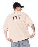 ‘777’ Men’s Oversized Beige Designer T-shirt with 3D Print Detail featuring a clean beige base and designer look