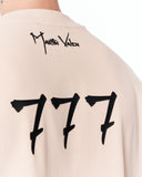 ‘777’ Men’s Oversized Beige Designer T-shirt with 3D Print Detail paired with loose light blue denim jeans