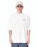 Men's Oversized Martin Valen Screen Printed White Heavy T-Shirt styled with dark cargo jeans and white sneakers