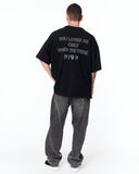 Loved Me Text Print Oversized Black T-Shirt paired with baggy grey jeans