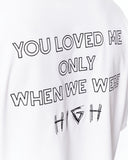 Loved Me Text Print Oversized White T-Shirt paired with washed denim