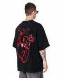No Heart Graphic Oversized Black T-Shirt styled with grey baggy jeans