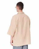 Men’s Oversized Linen Fabric Shirt with V-Neck in Beige paired with loose light blue denim jeans