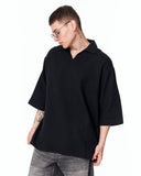 Men’s Oversized Linen Fabric Shirt with V-Neck in Black worn with round sunglasses and white shoes