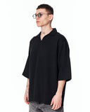 Men’s Oversized Linen Fabric Shirt with V-Neck in Black shown on a model in a clean studio front view