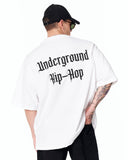 Underground Hip Hop Oversized White T-Shirt paired with washed denim jeans