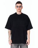 Martin Valen Men’s Oversized Embossed Basic Black T-shirt styled with faded grey jeans and white sneakers