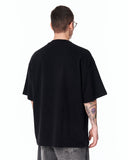 Martin Valen Men’s Oversized Embossed Basic Black T-shirt paired with relaxed washed grey denim