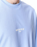 "Slogan" Men’s Oversized Printed Designer T-shirt in Blue paired with loose black pants