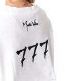 A close-up of a white crewneck sweatshirt featuring a black Martin Valen signature logo and the number '777' printed on the back.