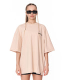 Oversized Chest 3D Printed Back Transfer Printed Beige T-shirt styled with black biker shorts