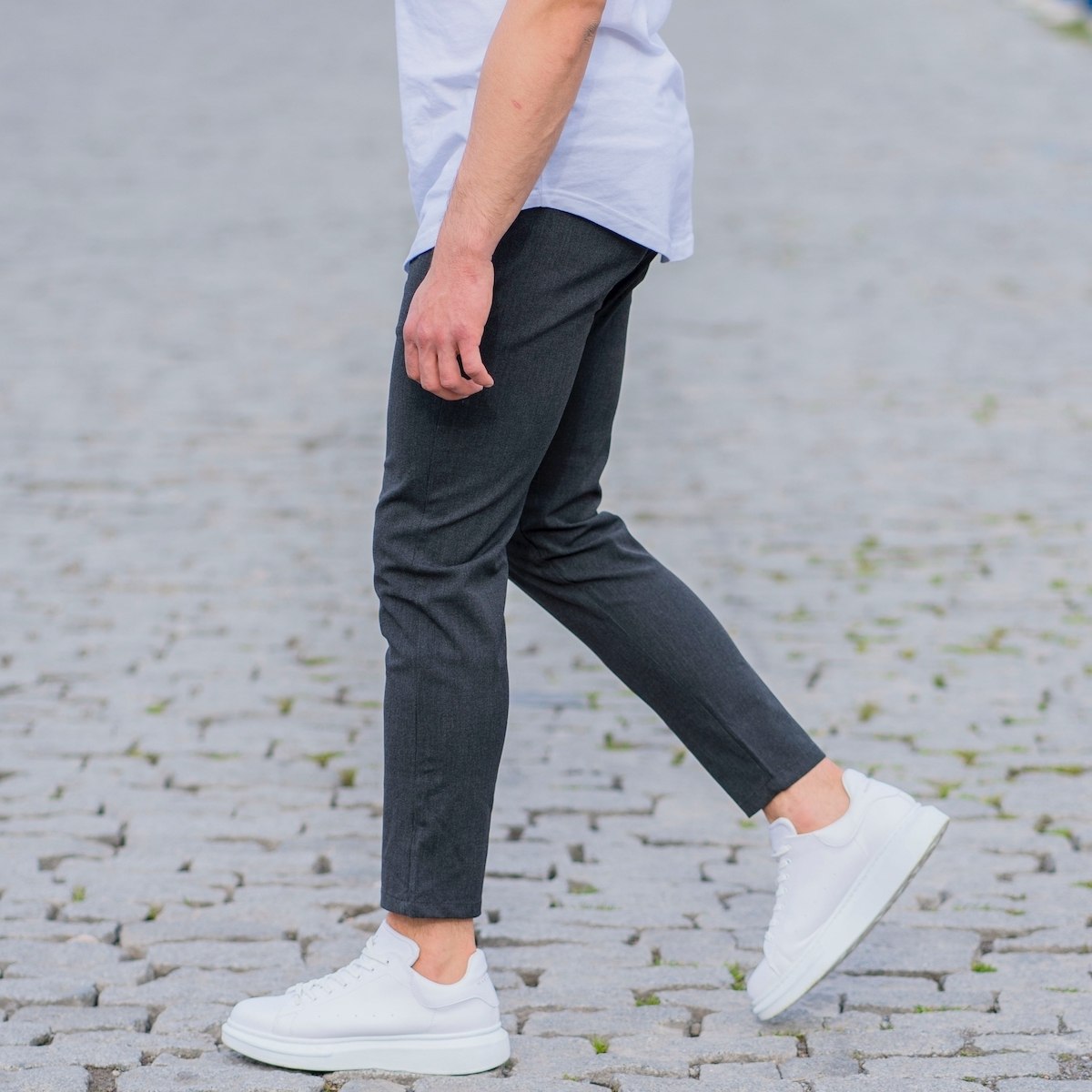 Premium Photo  Attractive woman in a white shirt and black trousers white  sneakers with genuine leather on her feet summer female casual fashion