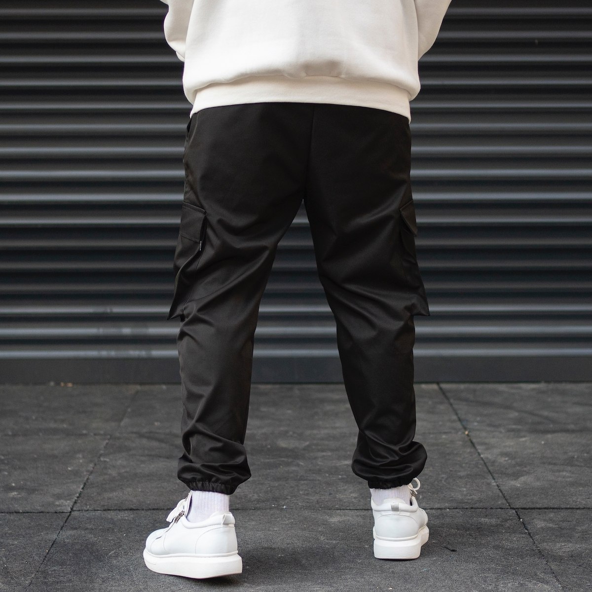 Men's Cargo Pocket Oversize Jogger Jeans With Text Detail And Elastic Hem In Black