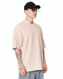 ‘777’ Men’s Oversized Beige Designer T-shirt with 3D Print Detail shown on a model in a clean studio front view