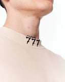 ‘777’ Men’s Oversized Beige Designer T-shirt with 3D Print Detail featuring an oversized fit and soft beige tone