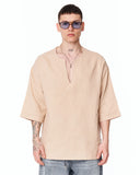 Men's Linen Fabric Oversized Beige T-shirt styled on a model with baggy jeans