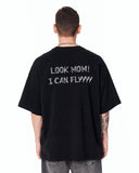 Look Mom Text Print Oversized Black T-Shirt paired with grey denim jeans