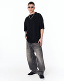 Loved Me Text Print Oversized Black T-Shirt styled with black sneakers