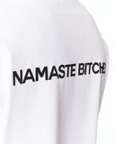 Namaste Streetwear Oversized White T-Shirt paired with washed denim jeans
