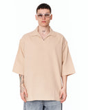 Men’s Oversized Linen Fabric Shirt with V-Neck in Beige styled with light wash baggy jeans and white sneakers