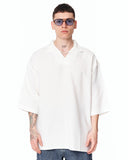 Men’s Oversized Linen Fabric Shirt with V-Neck in White styled with blue cargo jeans and white sneakers