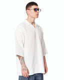 Men’s Oversized Linen Fabric Shirt with V-Neck in White shown on a model in a clean studio front view