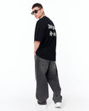 Underground Hip Hop Oversized Black T-Shirt styled with denim and sneakers