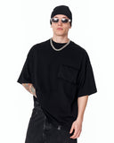 Utility Pocket Oversized Black T-Shirt paired with blue denim jeans