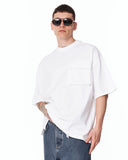 Utility Pocket Oversized White T-Shirt paired with blue denim jeans