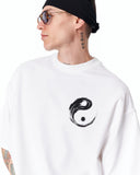 Yin Yang Brush Graphic Oversized White T-Shirt styled with washed grey denim