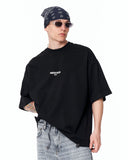 "Slogan" Men’s Oversized Printed Designer T-shirt in Black shown against a light grey background