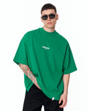 "Slogan" Men’s Oversized Printed Designer T-shirt in Green in a full-body studio product image