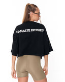 Women’s black streetwear crop-top styled with biker shorts