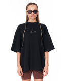Oversized Monarch Loop Black T-Shirt styled with brown biker shorts