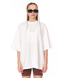 Oversized Monarch Loop White T-Shirt styled with brown biker shorts