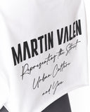 White t-shirt featuring a black graphic print with the text 'MARTIN VALEN' in a bold sans-serif font, followed by 'Representing the Street Urban Culture and You' in a script font.